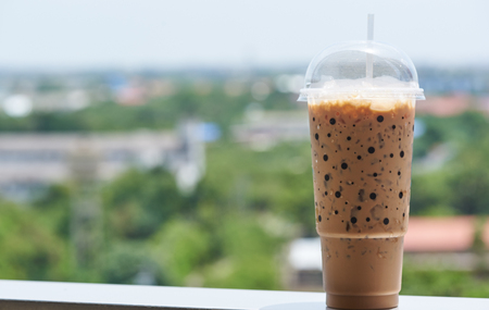 A tasty cup of iced coffee in a sunny dayの写真素材