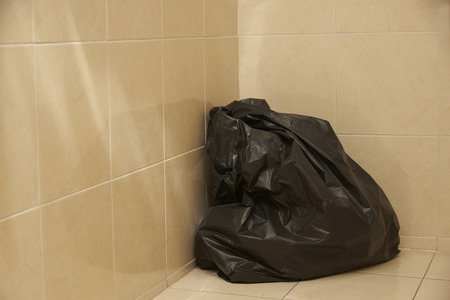 Surgical garbage in black plastic bag in operating roomの写真素材