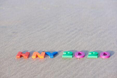 Happy new year 2020. Texts and alphabets  on the beach