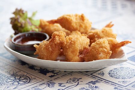 A plate of delicious fried prawn balls on the tableの写真素材