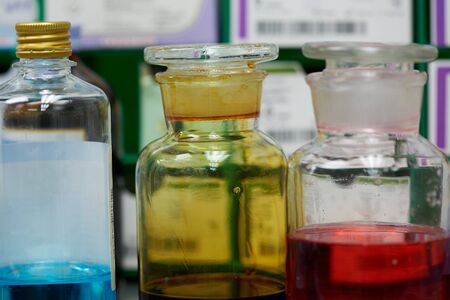 Antiseptics in glass bottle on the shelf in operating room.
