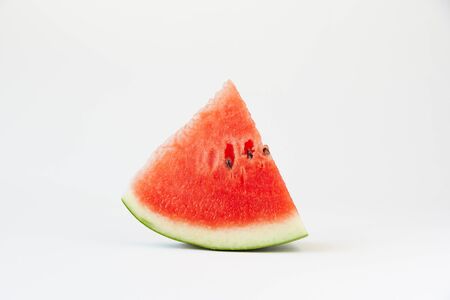 A piece of sliced delicious watermelon on white background