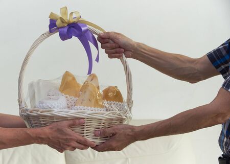 A man giving a basket of mango sticky rice for new year gift