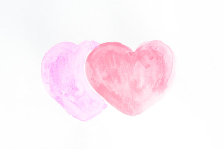 Watercolor painting of two hearts on white backgrundの写真素材