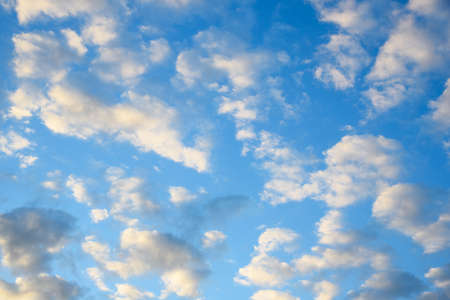 Cumulus clouds on blue sky background