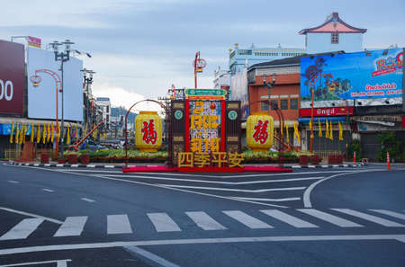 Phuket, Thailand-Oct 1, 2021- Fountain circle at downtown Phuket celebrating vegetarian festival. Chinese and Thai texts mean eating vegetable.のeditorial素材