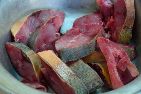 Close-up raw grouper fish before cooking in a bowlの写真素材