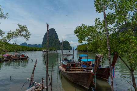 Long-tail boats for tourists at Ban Hin Rom Pierの写真素材