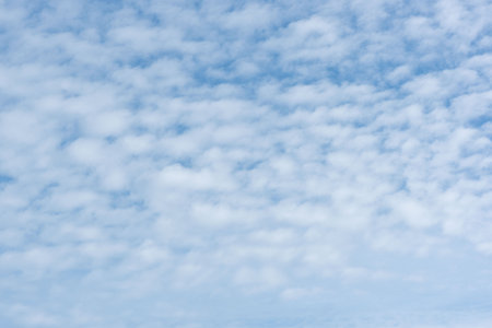 Fluffy clouds and blue sky background.の写真素材
