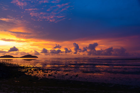 Scene of beautiful twilight sky and the beach at Saphanhin, Phuket, Thailand.の写真素材