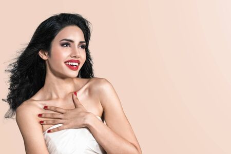 Smile beautiful asian woman with red lips and make up beauty face is satisfied, shocked, surprised, delighted and pleased. Happy young girl with cosmetic is laugh and looking to copy space.の写真素材