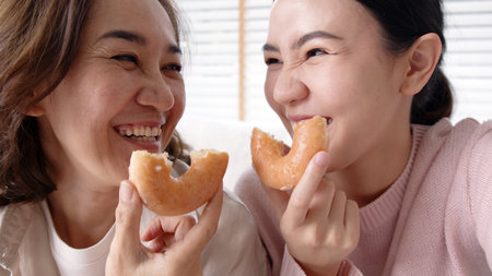 Portrait attractive beautiful two people family use cellphone take photo picture doughnut video...