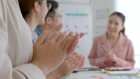 Small group asia female young happy people, sale team work in reskill upskill training class share plan idea in project research job feel bonding thankful respect greeting smile sit in office room.の写真素材