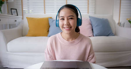 POV screen front view of asia people teen girl sit relax smile cheerful at sofa enjoy talk share in...