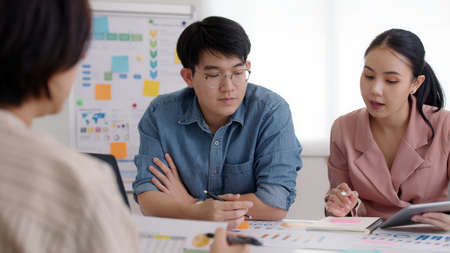 Small group of asia people, data analyst mba college student or smart sale team worker share plan...