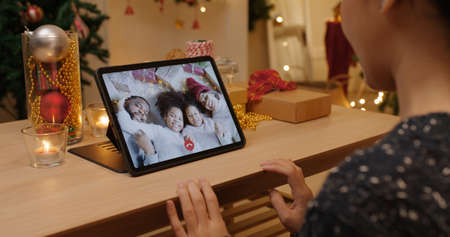 X'mas asia happy woman relax smile laugh greet in digital tablet screen remote talk to child kid...