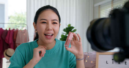 Asia woman micro influences record live viral video camera at home studio.の写真素材