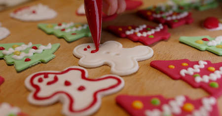 Close-up hand happy enjoy fun make craft gift X'mas party snack tasty cooking recipe on table in...