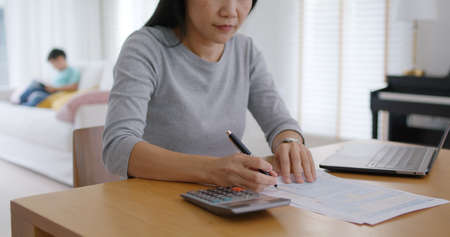 Adult asia people single mom small SME owner support happy sit busy apply child tax credit refund...