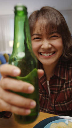 Selfie view of young happy attractive asia woman enjoy relax night party event online celebration...