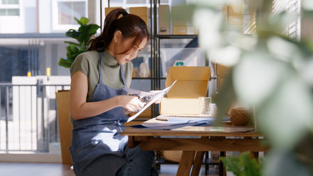 Eco vendor go green packaging parcel carton box in net zero waste store asian seller retail shop....