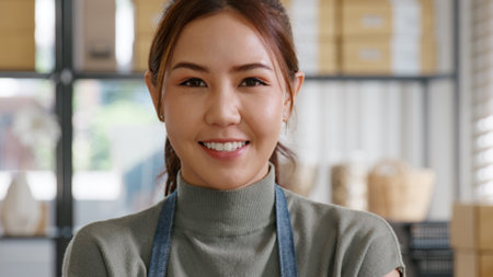 Go green use eco friendly packaging box in net zero waste store asian seller retail home office shop. Small SME owner young adult asia Gen Z people happy relax smile pride arm cross looking at camera.の写真素材