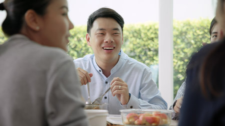 Gen Z asia people group save the planet earth relax eating food go green meal eco friendly glass lunch box reduce plastic waste free water bottle at table SDGs office. ESG net zero happy staff team.の写真素材