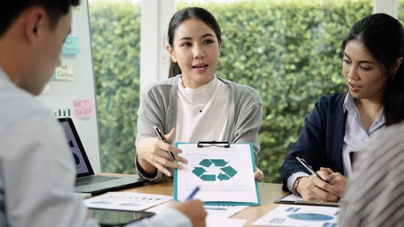 Carbon offset price report CO2 emission. Future growth Net zero waste in ESG ethical SME office protect climate change global warming social issues project. Group of asia people Eco friendly SDGs planの写真素材