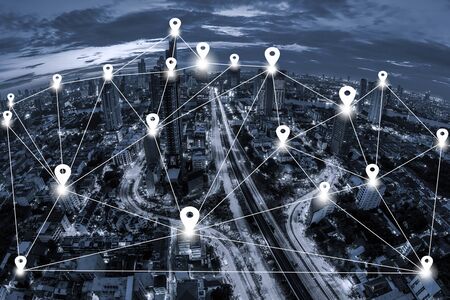 Map pin flat and network connection concept on blue tone Aerial view of cityscape Bangkok business district  background.の写真素材