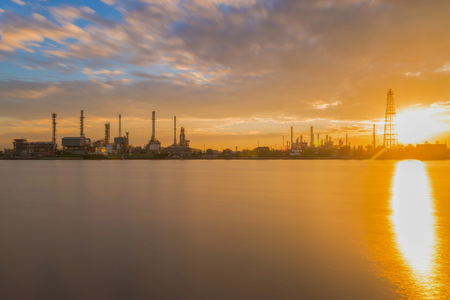 Oil refinery or petroleum refinery industrial process plant with sunrise, oil refineries use much of the technology, as types of chemical plants, the downstream side of the petroleum industry.の写真素材
