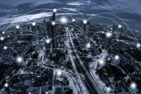 Network business conection concept on blue tone Aerial view of cityscape Bangkok business district at twilight  background.の写真素材