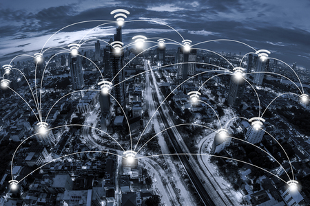 Wifi network connection concept and Network business conection system on blue tone Aerial view of cityscape Bangkok business district at twilight  background.の写真素材