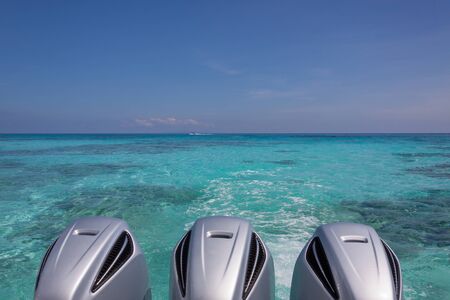 Speed Boat Engines on turquoise seaの写真素材