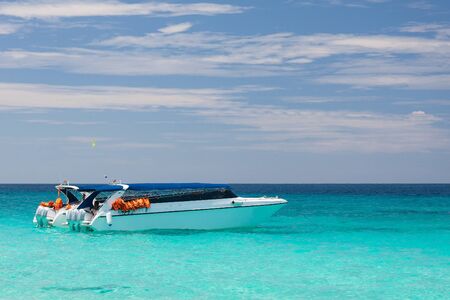 Beautiful sea landscape with tropical coast and the high-speed boatの写真素材