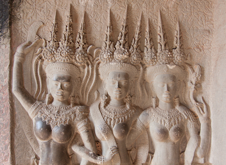 Apsara Dancers Stone Carving all around on the wall at Angkor wat, SiemReap, Cambodiaの写真素材