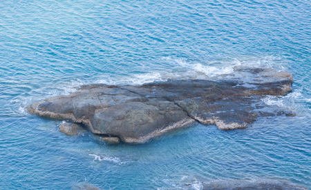 Rock on the blue sea.の写真素材