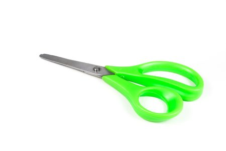 Green scissors isolated on a white background.の写真素材