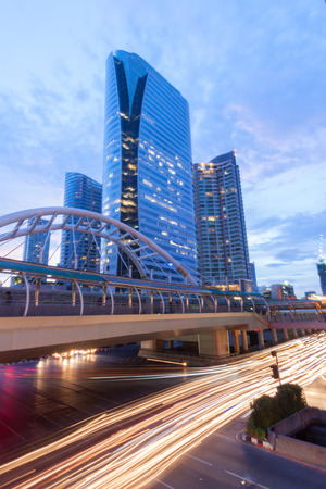 View of high buildings and public sky walk for transit between Sky Transit and Bus Rapid Transit Systems at Sathorn-Narathiwas junctionの写真素材