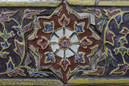 Texture of Ancient Ceramic tile decorated with Thai art