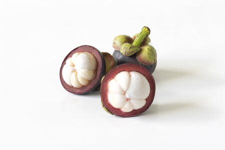 Three mangosteen with an elegant white backgroundの写真素材