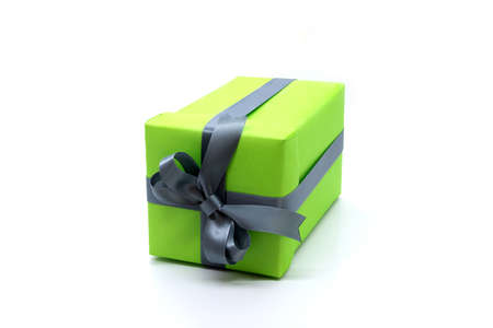 Green gift box with ribbon isolated on white backgroundの写真素材