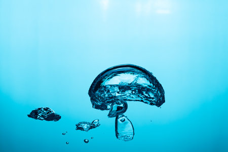 Big air bubble are rising in the blue water , air bubble isolated on blue background.