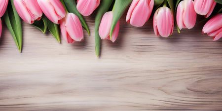 Bouquet of pink tulips on wooden background. Top view with copy space. By Generative AI.の素材