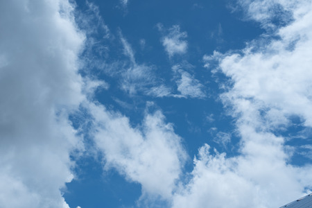 blue sky background with tiny clouds