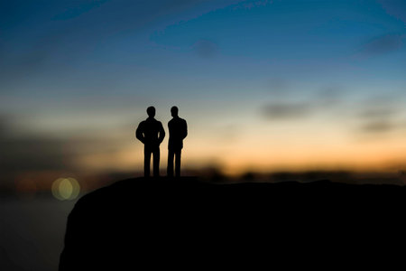 Two businessmen are negotiating business in the sunset. Two businessmen business negotiations.(Silhouette)の写真素材