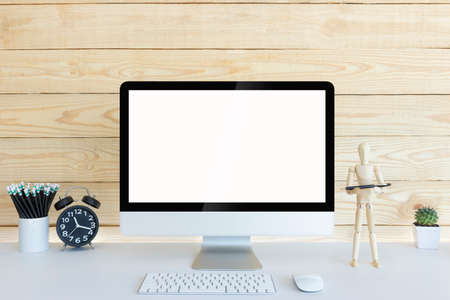 Computer with blank white copy space for text and wood background, Mockup design desktop computer in...