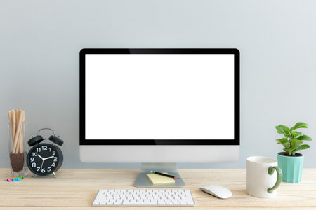 Computer with blank white copy space for text, Mockup design desktop computer in office on wood table with keyboard and Green coffee cub, Lovely black alarm clock.の写真素材