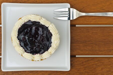 Blueberry pie on white plateの写真素材