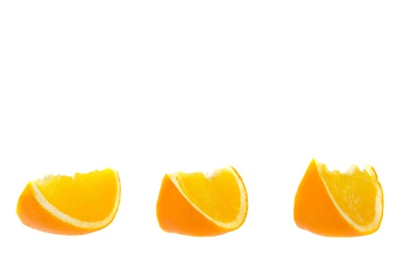 Three pieces of orange  isolated on whiteの写真素材