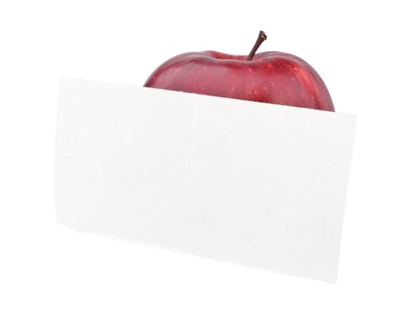 red apple and a note isolated on whiteの写真素材